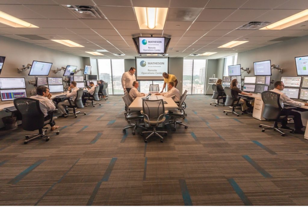 remote operations center monitors onsite production facilities